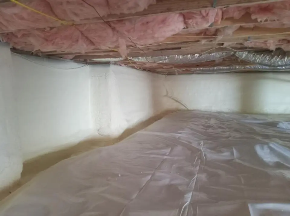 Crawl space encapsulation with closed-cell spray foam for Commercial Roof Restoration in Seymour